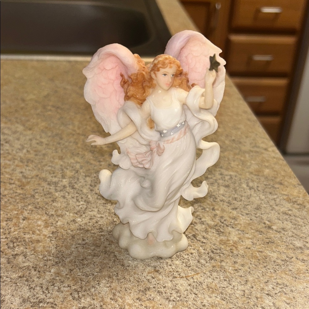 Porcelain Angel Figurine with Pink Wings